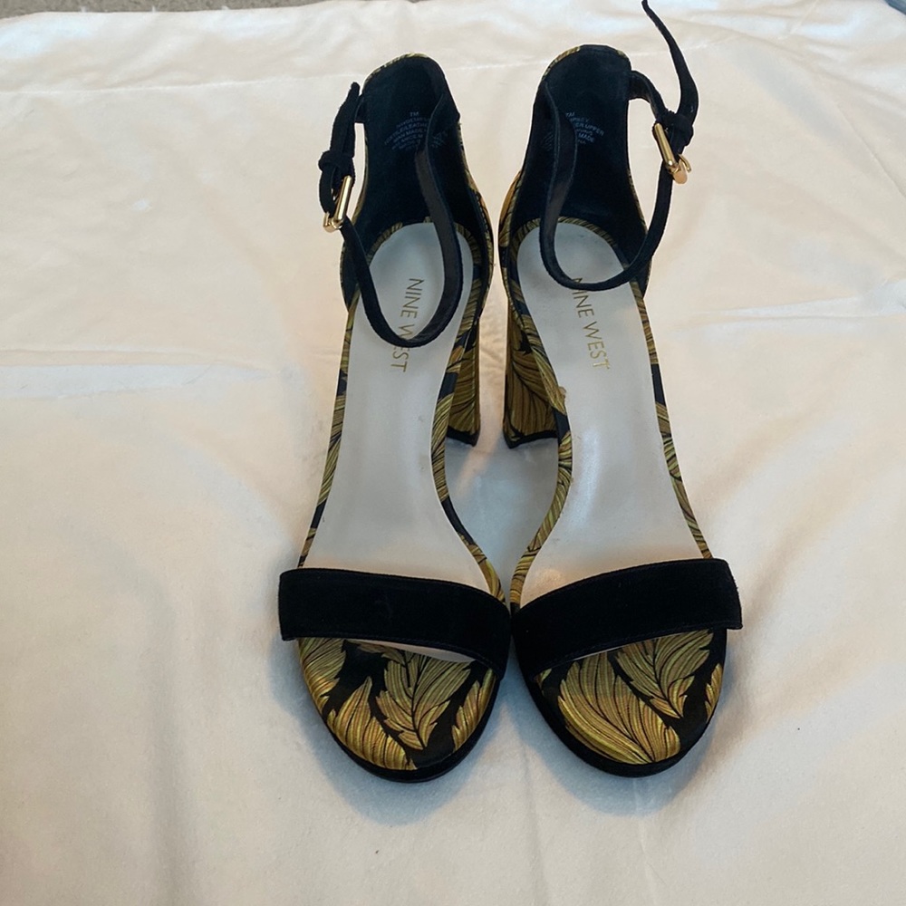 Black and gold open-toe block heel.